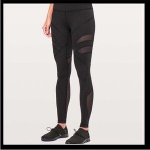 Black lululemon leggings size 2 with mesh cut outs and detailing